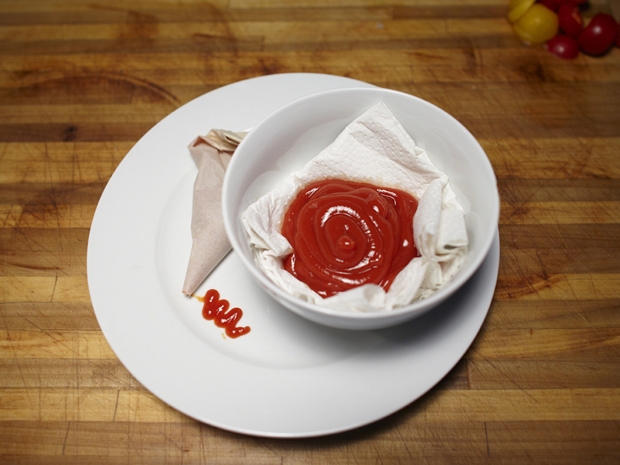 ketchup bowl of ketchup and piping bag