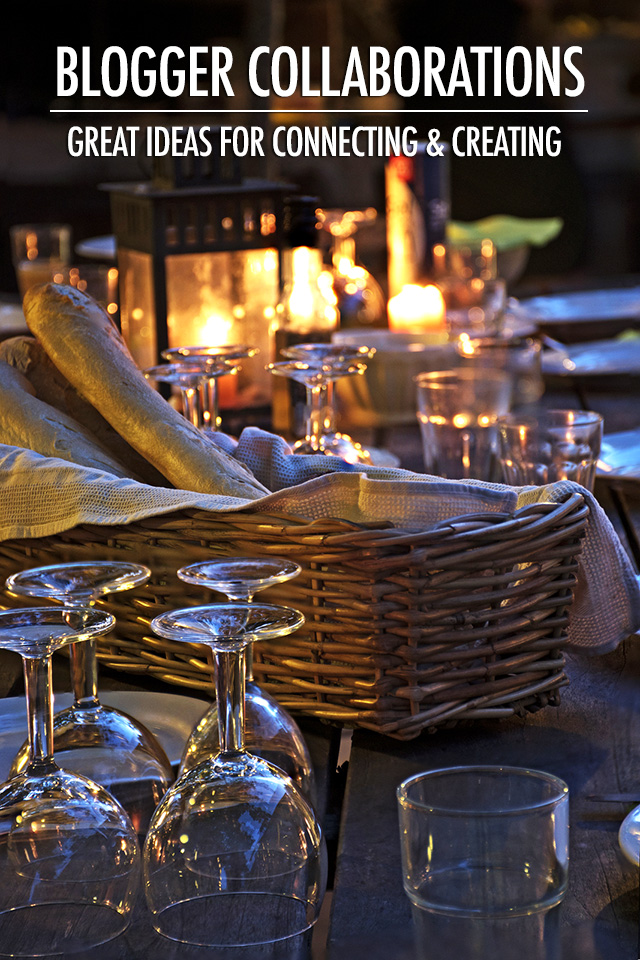 prepared table for a rustic outdoor dinner at night with wineglasses bread and candles vertical