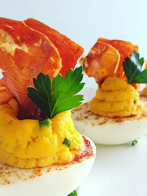 Sriracha Deviled Eggs with Crispy Serrano Ham | Everyday on Occasion