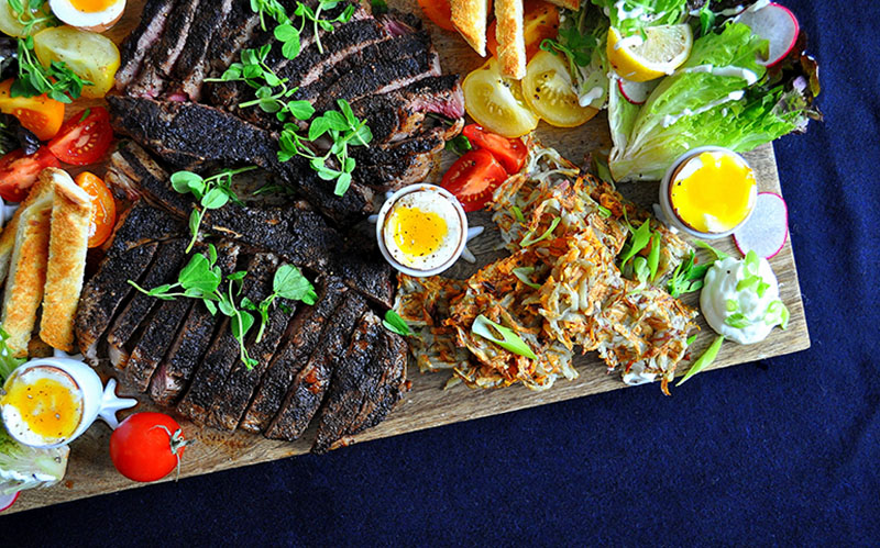 blackened steak with runny eggs