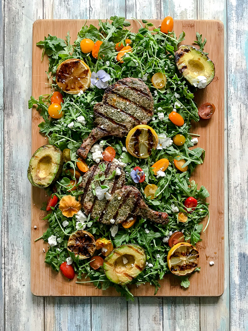 Grilled Pork chops on a bed of greens
