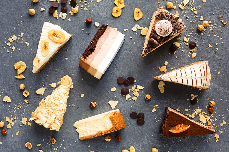 different types of pieces of cake on a table