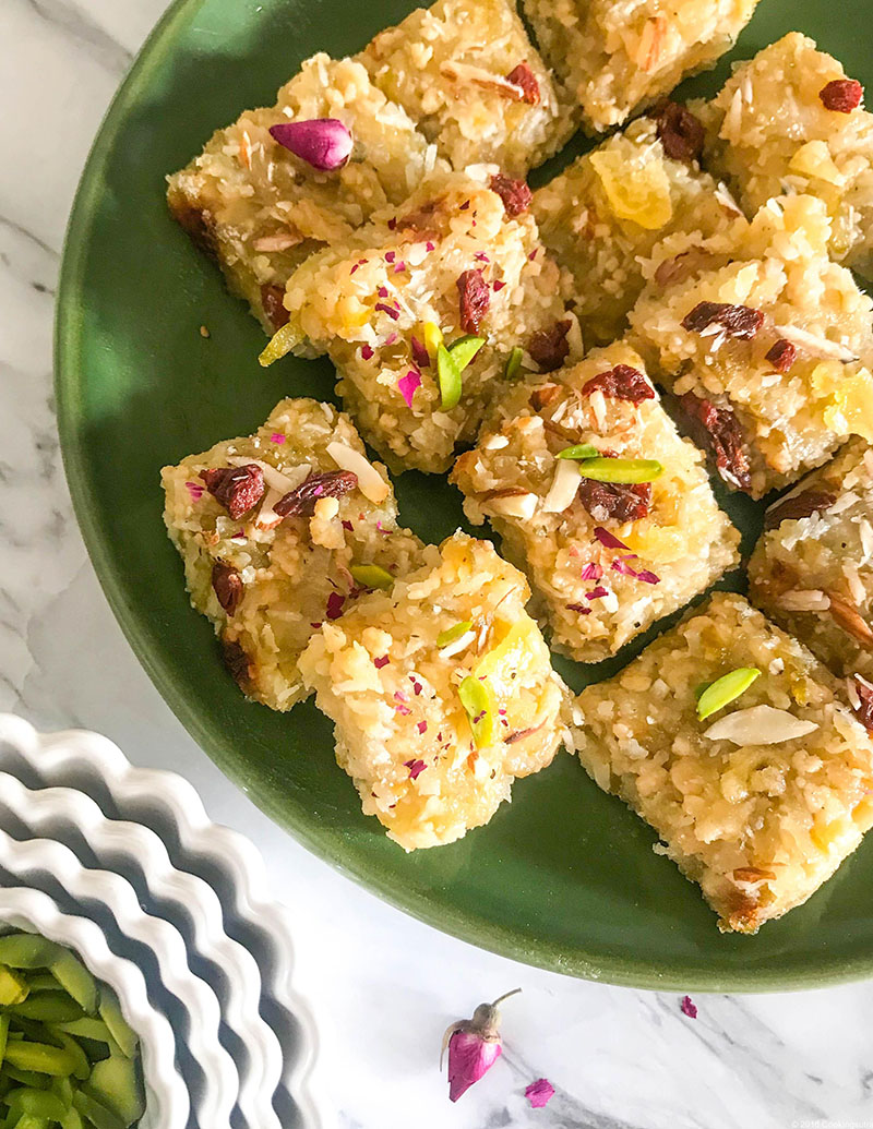 Squares of Indian pear fudge topped with pistachios and candied ginger