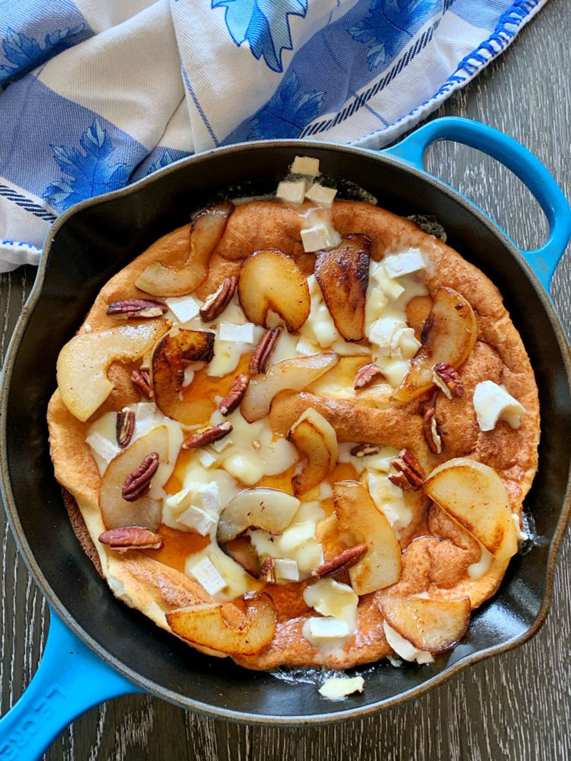 Pear Dutch Baby in a blue skillet