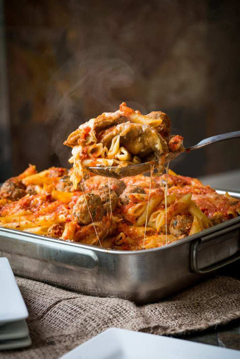 Baked Pasta al Forno scooped out with a spoon