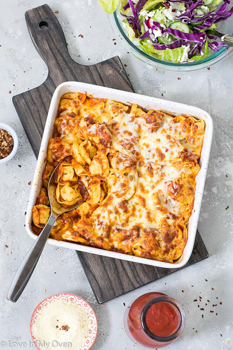 A casserole dish of cheesy baked tortellini