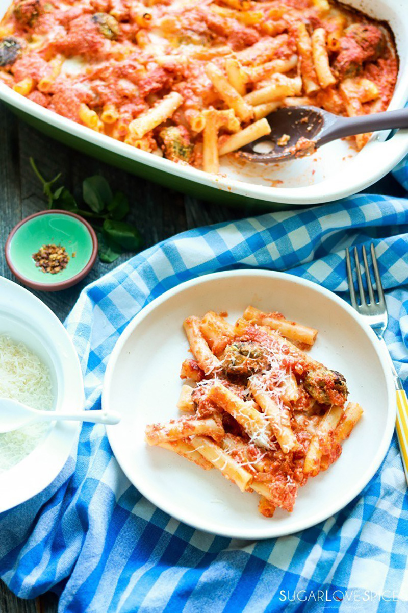 Dish of baked ziti and a serving on a plate