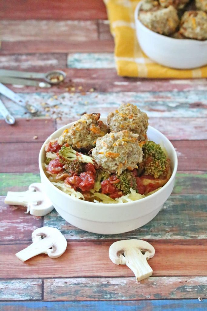 turkey meatballs on top of a bowl of spaghetti squash "noodles"