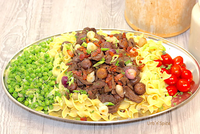 plated beef bourguignon with noodles and veggies
