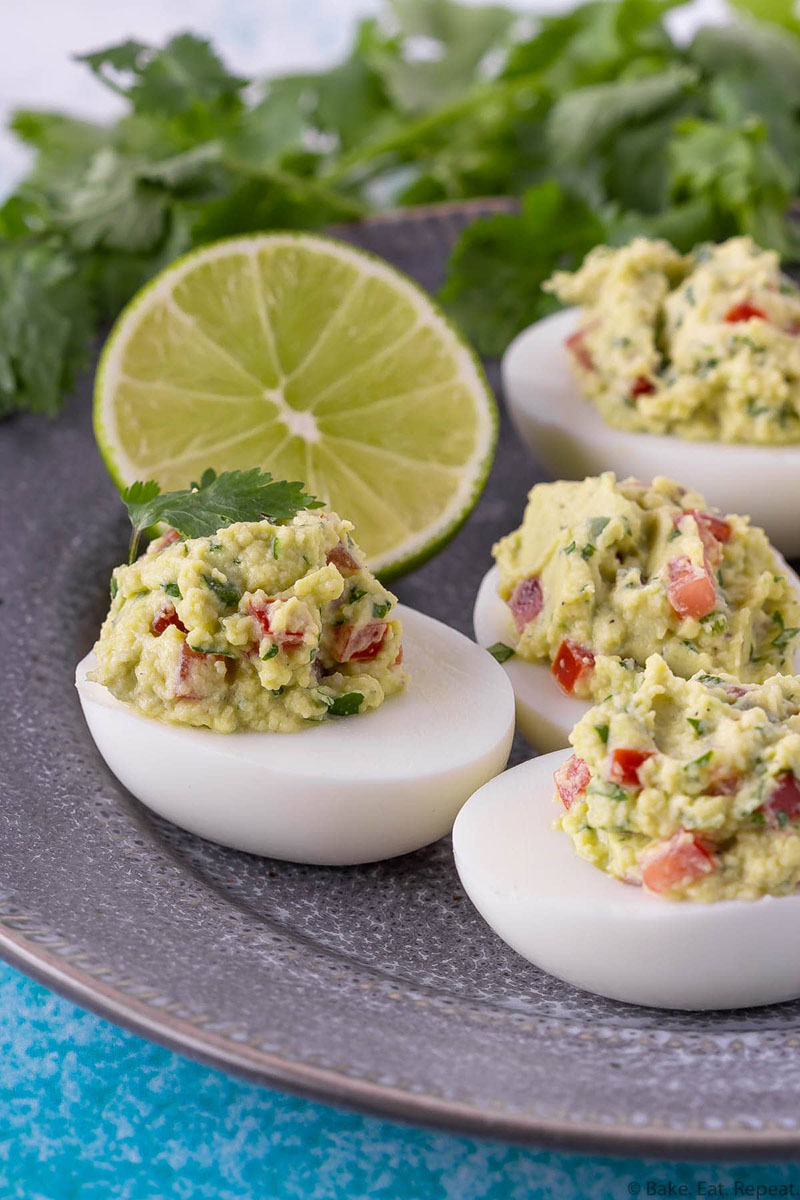 a plate of guacamole deviled eggs