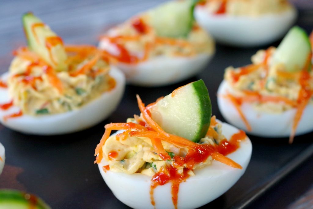 a plate of banh mi style deviled eggs