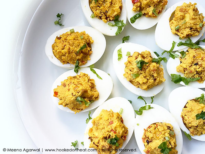 A platter of spicy masala deviled eggs