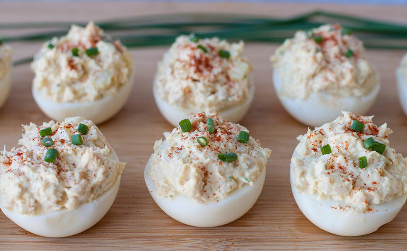 a tray of tuna salad deviled eggs