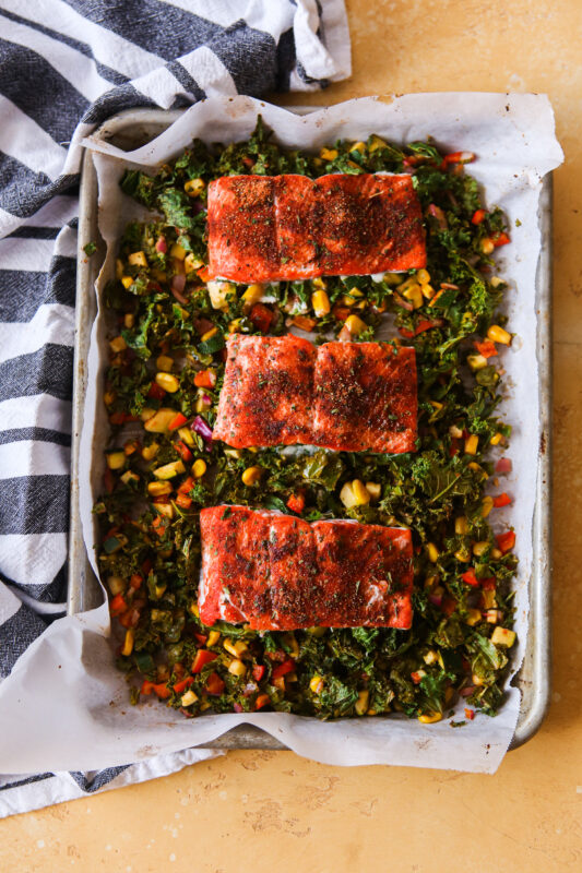 Cajun salmon on top of veggies