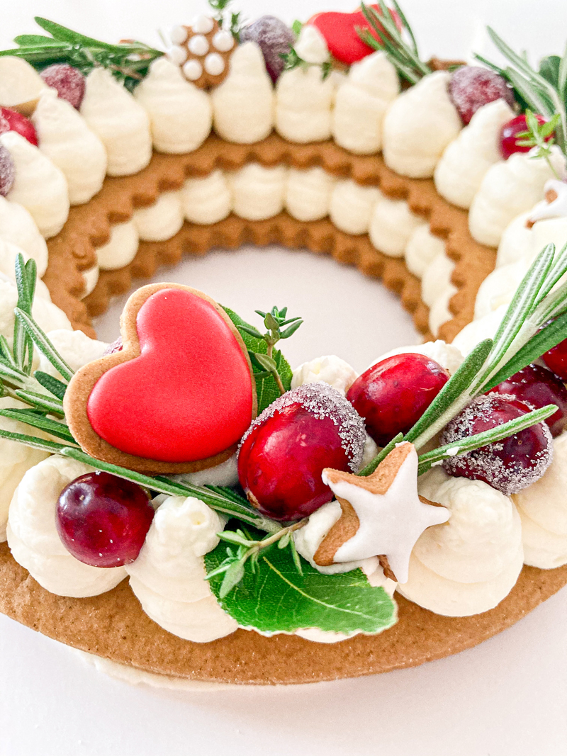 Decorated cake with cookie and cranberries.