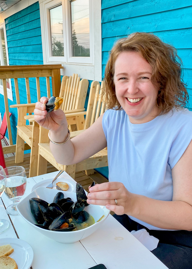 Photo of a person Gabby Peyton eating mussels