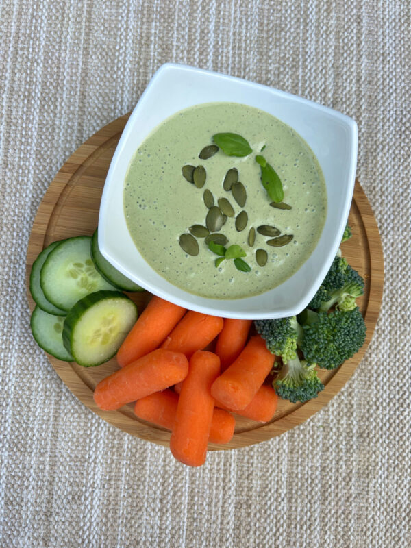 Basil dip with fresh carrots, cucumbers, broccoli.