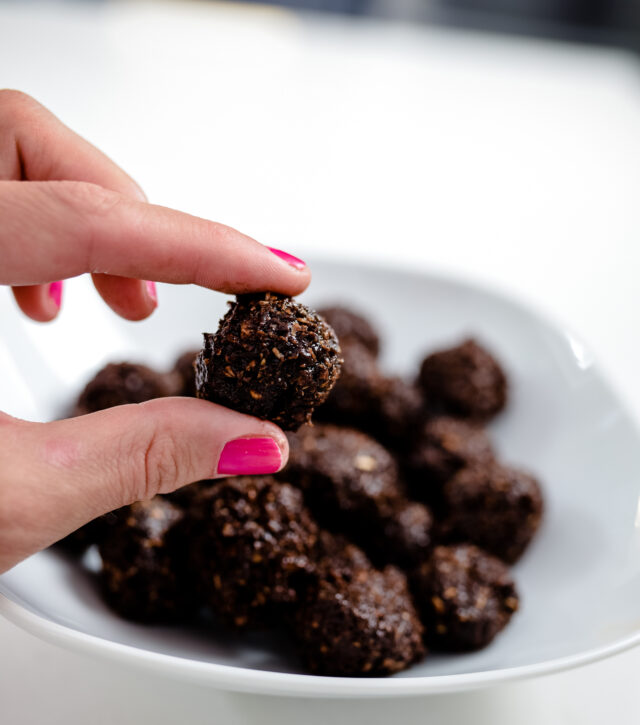 a hand holding Chocolate brownie balls