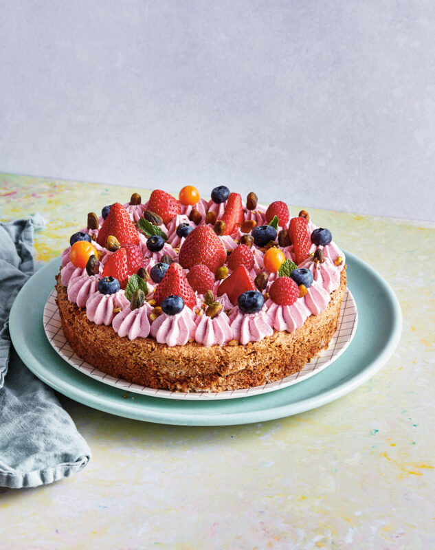 Pistachio cake with berries with strawberry Swiss meringue buttercream