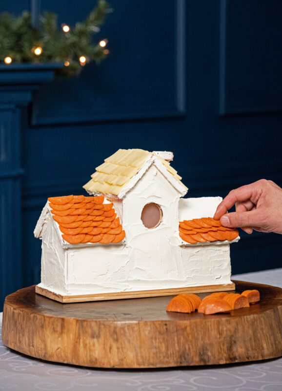 Charcuterie Christmas house with pepperoni and cheese.