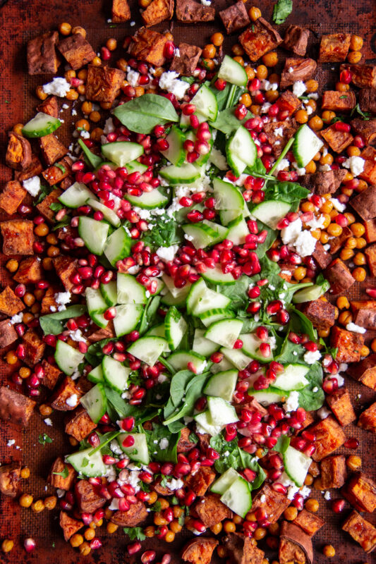 Sheet pan sweet potato salad with lemony tahini sauce.