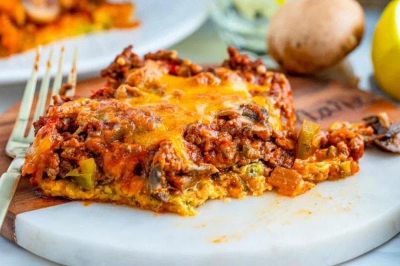 A piece of meaty zucchini casserole.